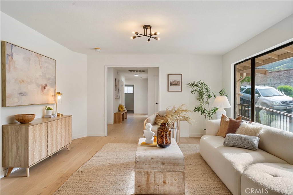 931 Camino Ramon Danville, CA 94526 - Photo 22 of 67 a living room with furniture and a chandelier
