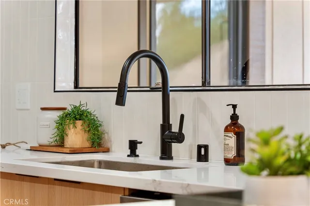 a bedroom with a bed and a lamp