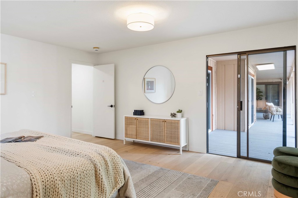 931 Camino Ramon Danville, CA 94526 - Photo 36 of 67 a bedroom with bed and a chandelier