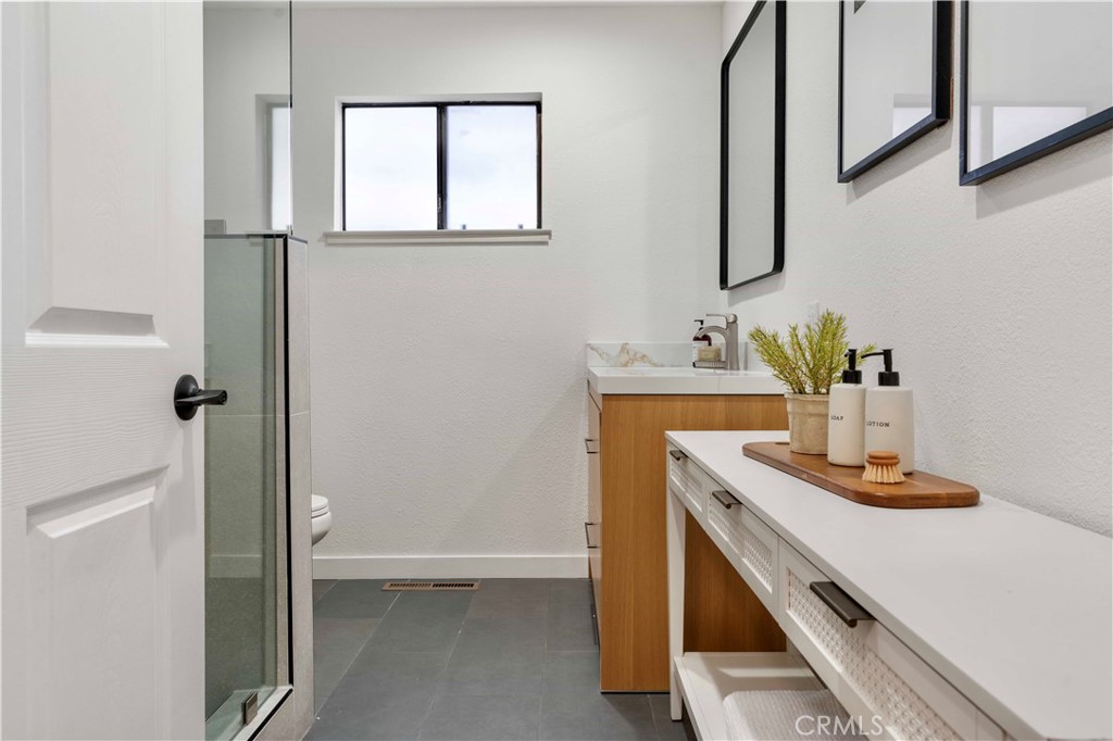 931 Camino Ramon Danville, CA 94526 - Photo 43 of 67 a bathroom with a sink and a mirror