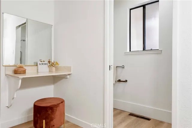a living room with furniture a table and a potted plant