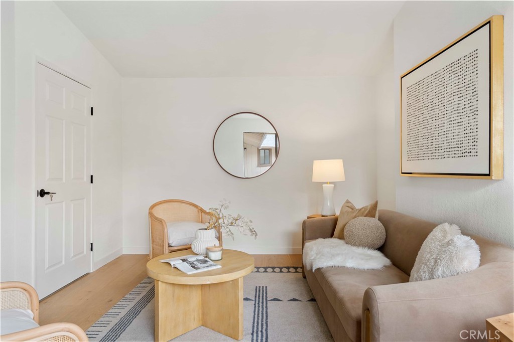 931 Camino Ramon Danville, CA 94526 - Photo 61 of 67 a living room with furniture a mirror potted plant and a window