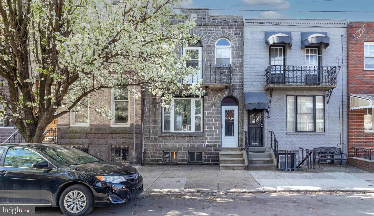 820 Tasker Street Philadelphia, PA 19148 - Photo 1 of 25 a front view of a house with parking space