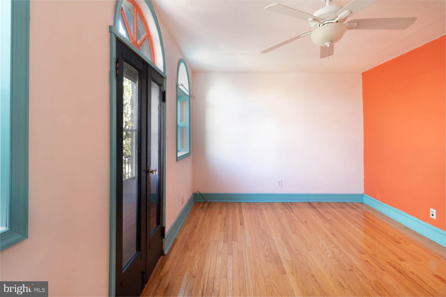 820 Tasker Street Philadelphia, PA 19148 - Photo 12 of 25 a view of hallway with a large window and wooden floor
