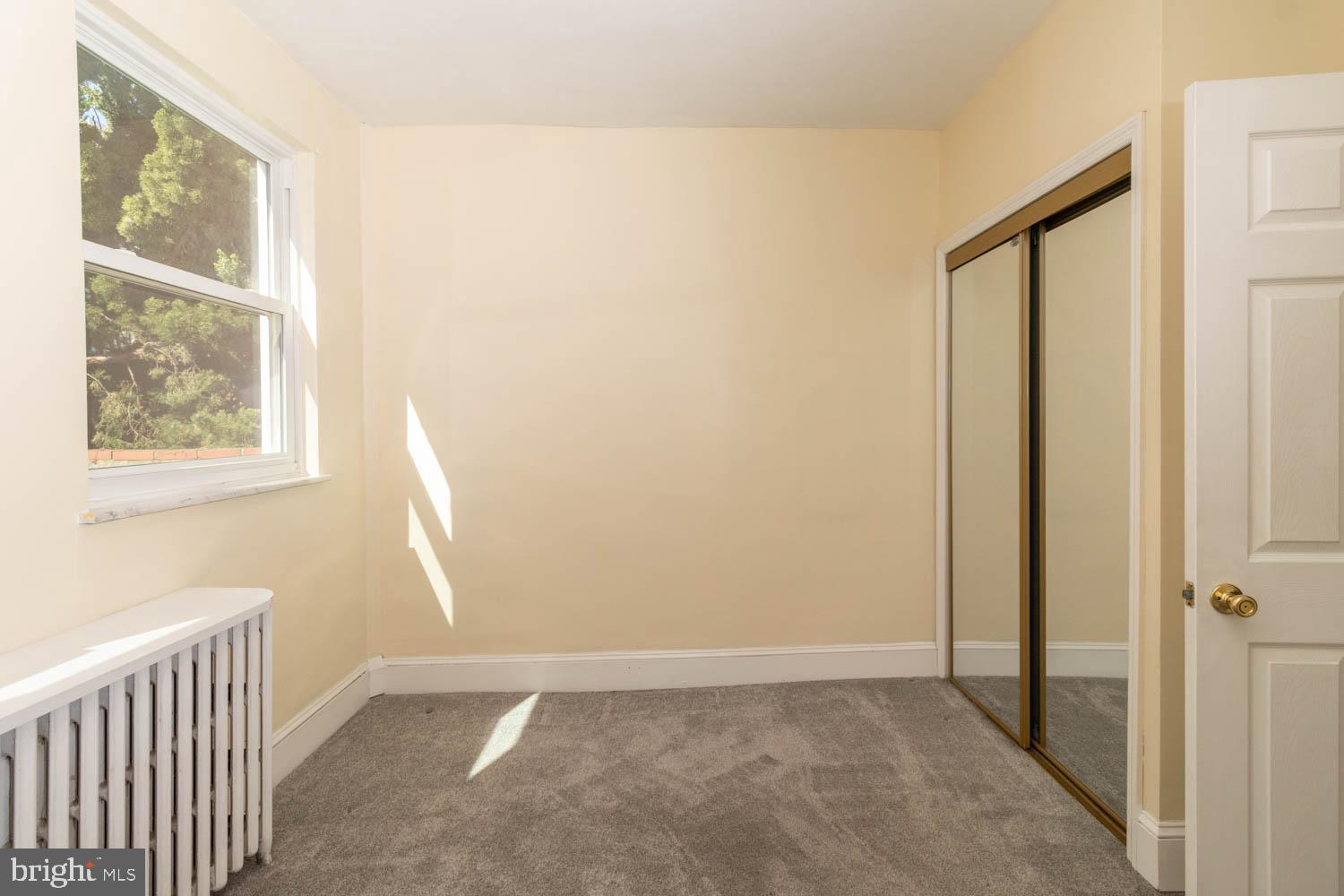 820 Tasker Street Philadelphia, PA 19148 - Photo 13 of 25 a view of an empty room with a window