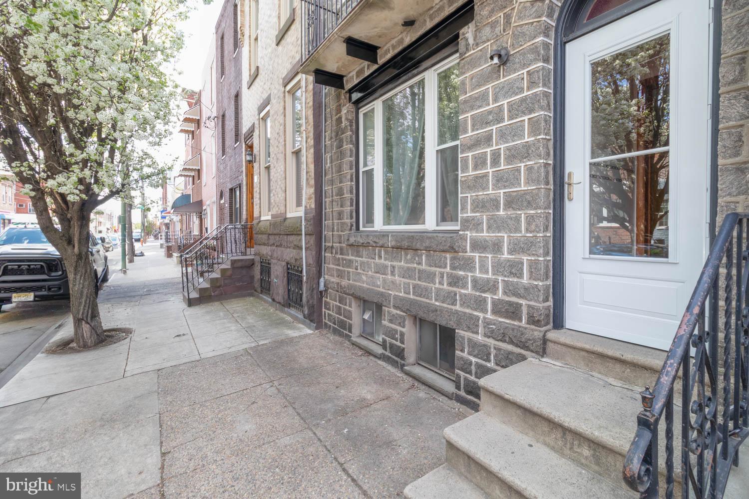 820 Tasker Street Philadelphia, PA 19148 - Photo 25 of 25 a view of brick house with a large tree