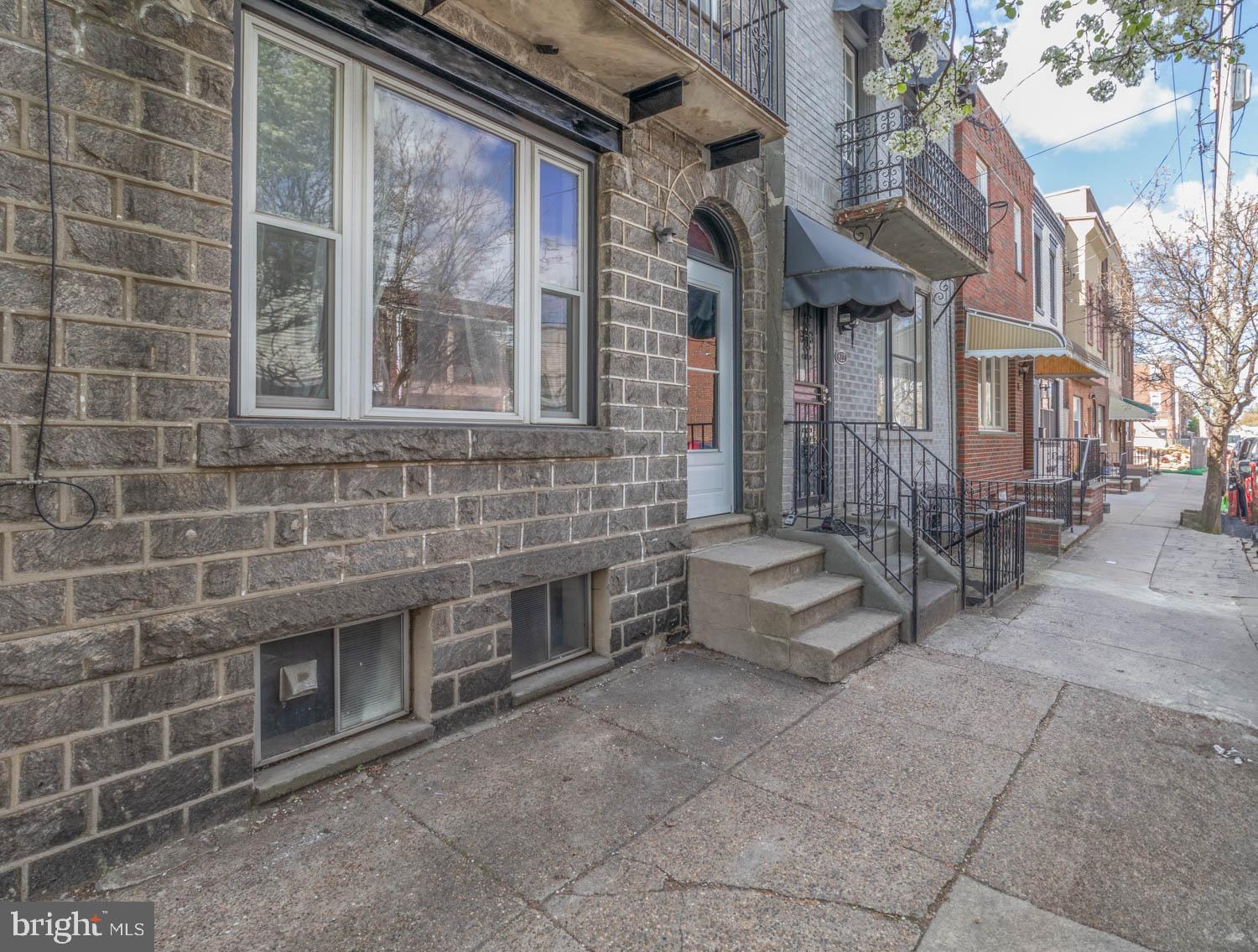 820 Tasker Street Philadelphia, PA 19148 - Photo 3 of 25 a front view of a house with yard