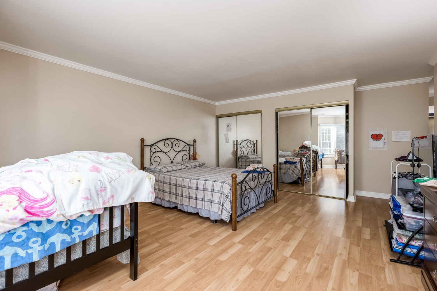 8630 Waukegan Road, Unit 317 Morton Grove, IL 60053 - Photo 12 of 15 a bedroom with two beds and a dresser