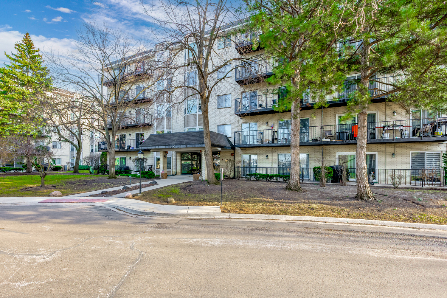 8630 Waukegan Road, Unit 317 Morton Grove, IL 60053 - Photo 2 of 15 a view of a building with a street