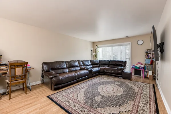 a living room with furniture and a rug
