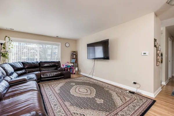 a living room with furniture and a rug