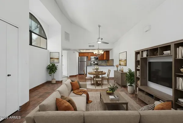 a living room with furniture and a flat screen tv