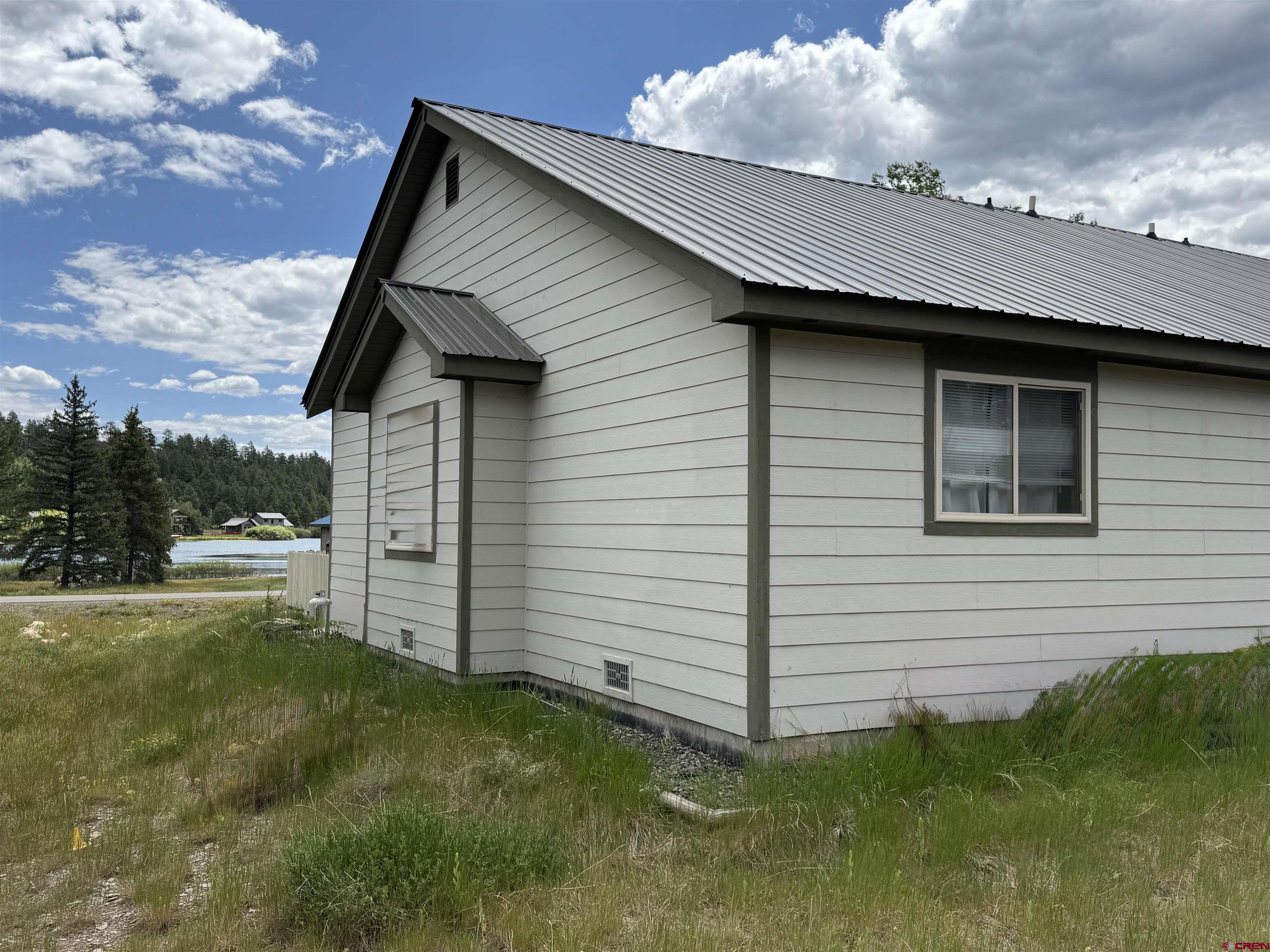 165 Butte Drive Pagosa Springs, CO 81147 - Photo 6 of 6 a front view of a house with garden