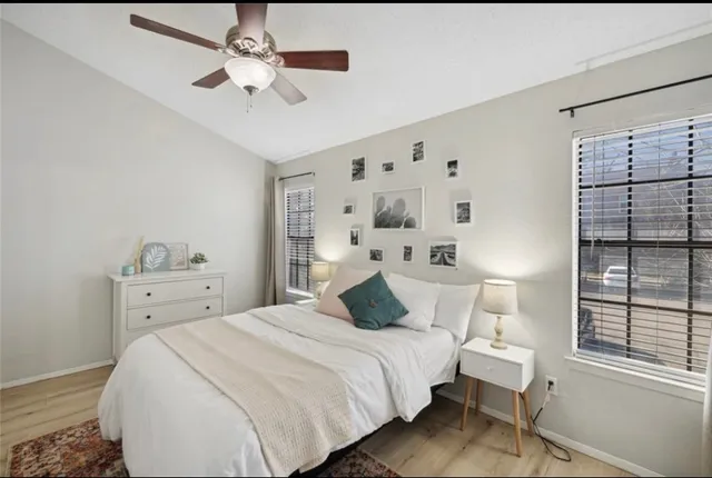 a bedroom with a bed and a window