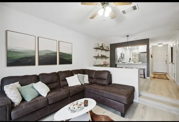 a living room with furniture and a large window