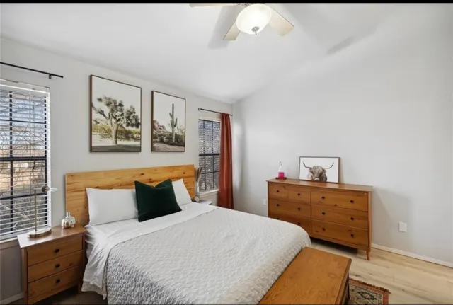 a bedroom with a bed and window