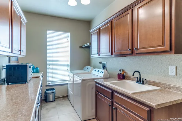 a living room with furniture and a lamp