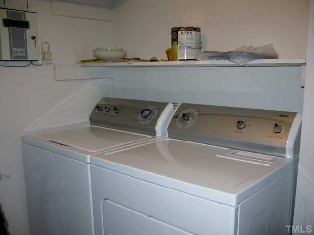 813 Green Ridge Drive Raleigh, NC 27609 - Photo 8 of 22 Large laundry room* Washer & DryerConvey* Shelf for Detergent & Cleaning Equipment*Extra shelves for canned goods & Large "seldom used Appliances"* Easy access to hot water heater, furnace & Security System* Laundry Room