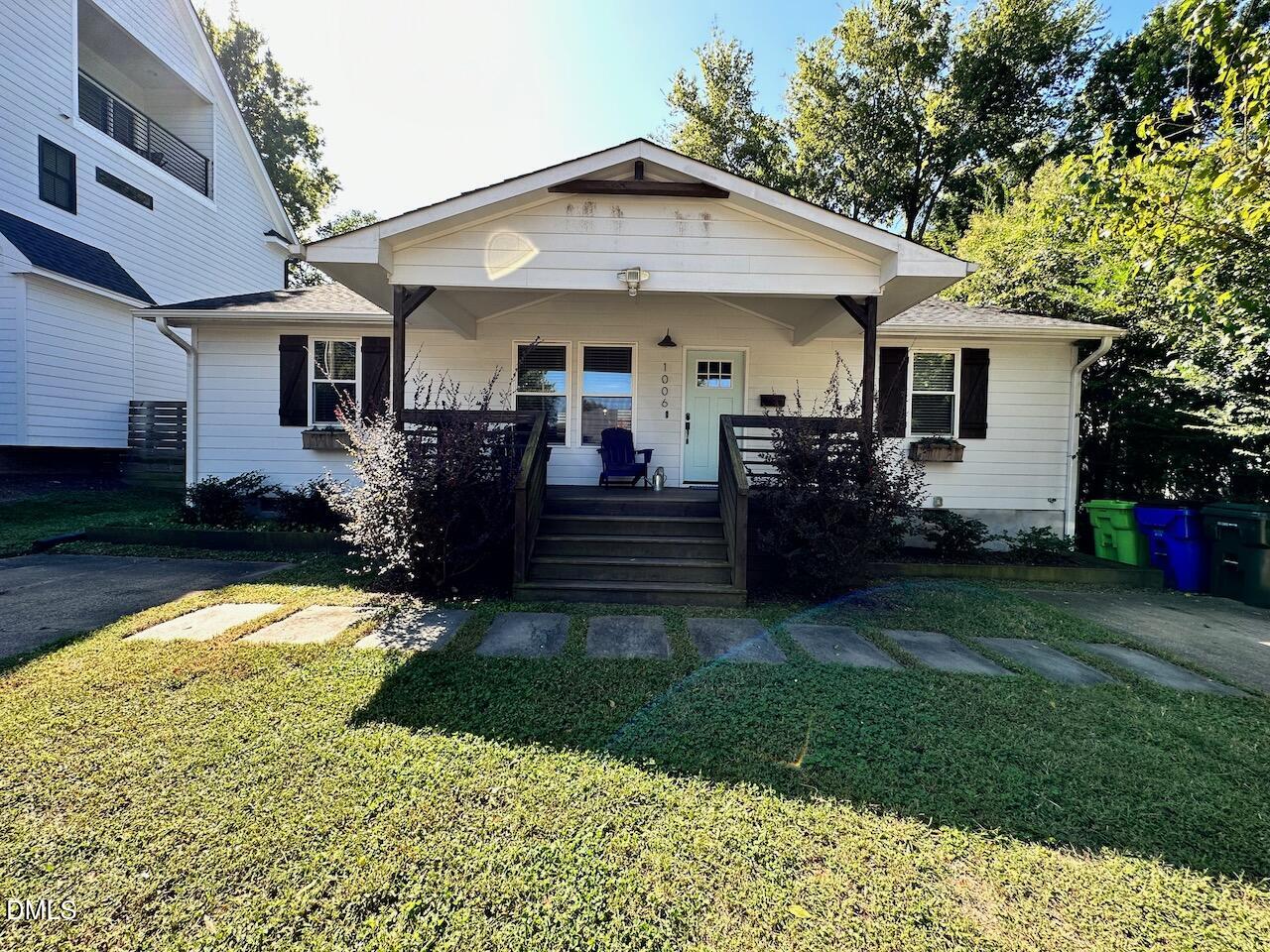 1006 East Martin Street Raleigh, NC 27601 - Photo 1 of 22 a front view of a house with a yard