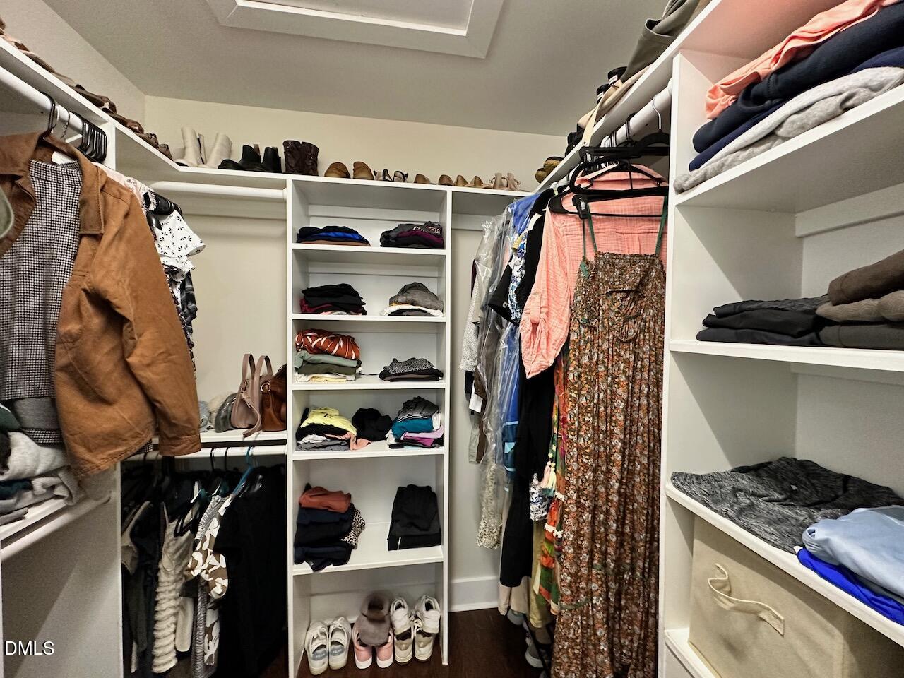 1006 East Martin Street Raleigh, NC 27601 - Photo 15 of 22 a view of walk in closet with clothes and shoes
