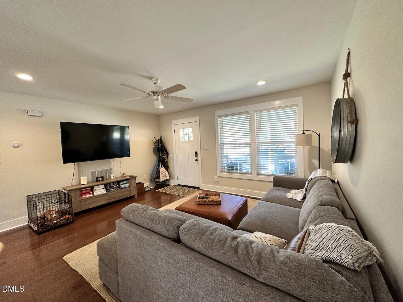 1006 East Martin Street Raleigh, NC 27601 - Photo 5 of 22 a living room with furniture and a flat screen tv