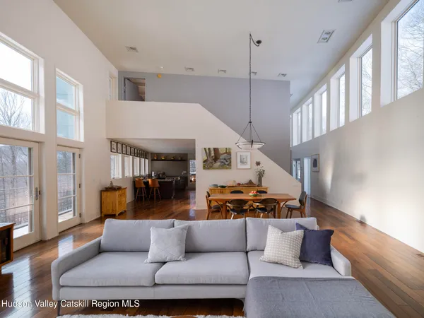 a view of a balcony with chair and wooden floor