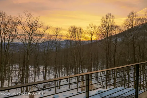 a living room with furniture a window and a table