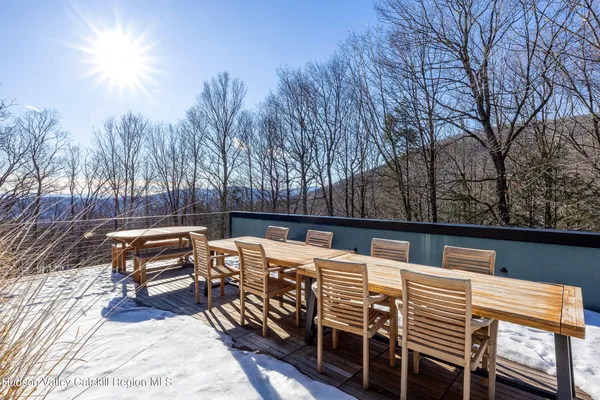 a living room with lots of furniture and a large window