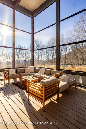 a living room filled with furniture and a window