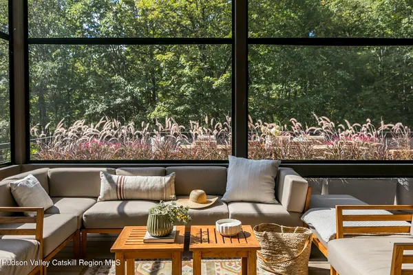 a living room with furniture and a table