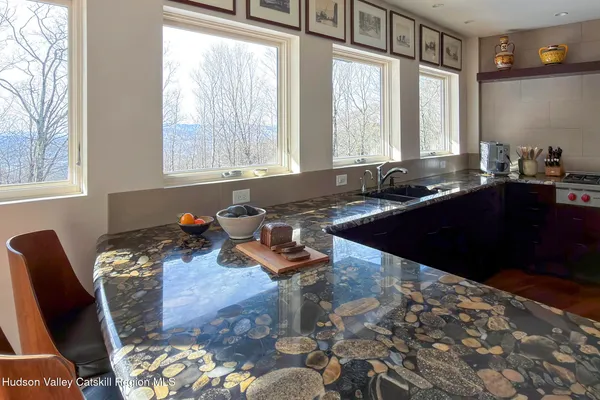 a living room with a book shelf and a book shelf