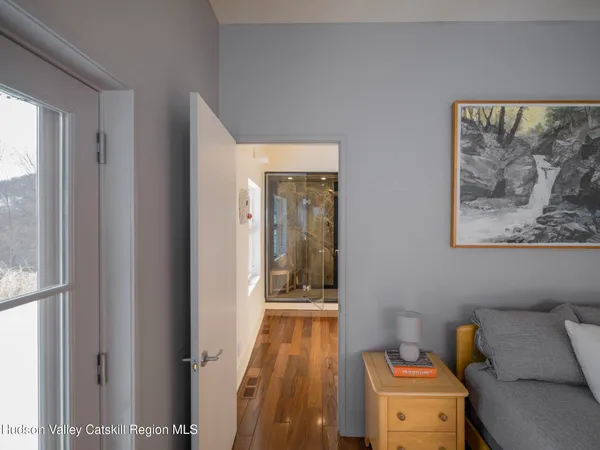 a living room with furniture and a lamp