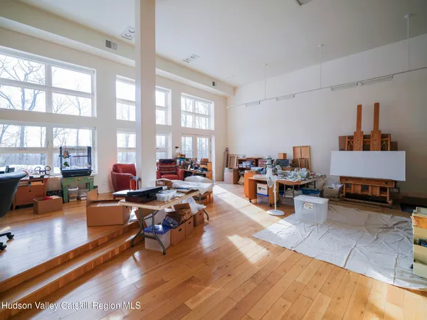 a bedroom with a bed and a night stand