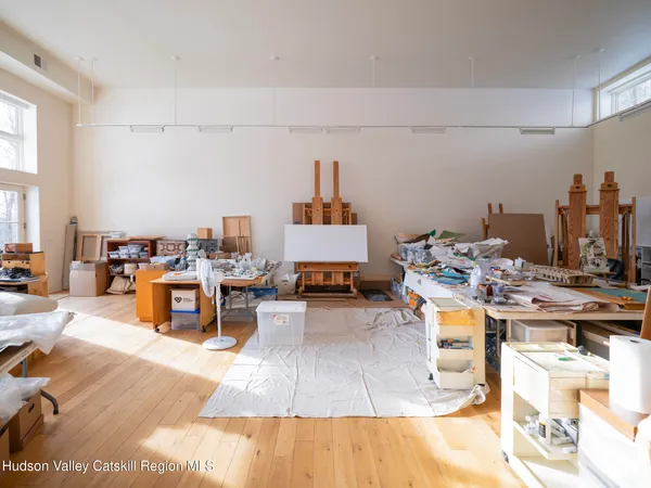 a view of a large mountain with mountains in the background
