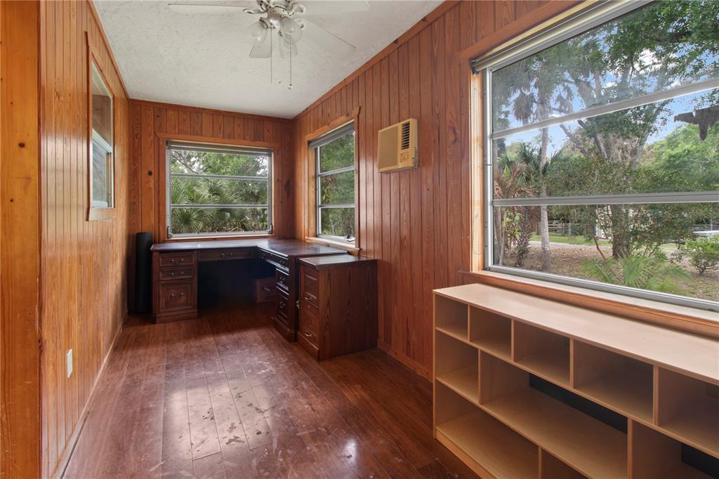 1143 Meyers Road Venice, FL 34292 - Photo 14 of 59 a room with a balcony a bed and a window