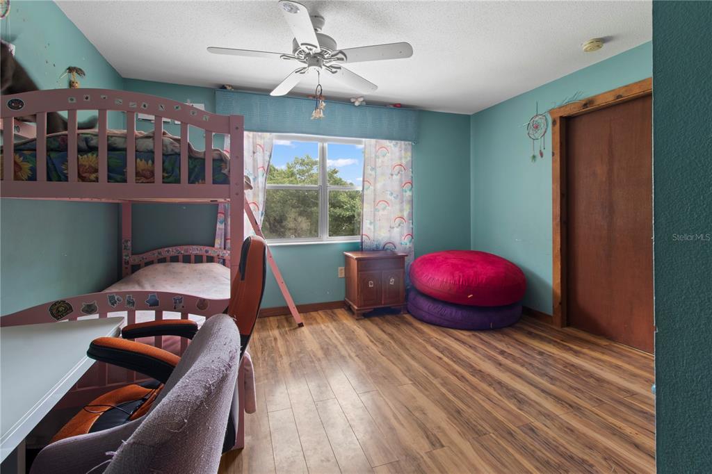 1143 Meyers Road Venice, FL 34292 - Photo 20 of 59 a living room with furniture and a floor to ceiling window