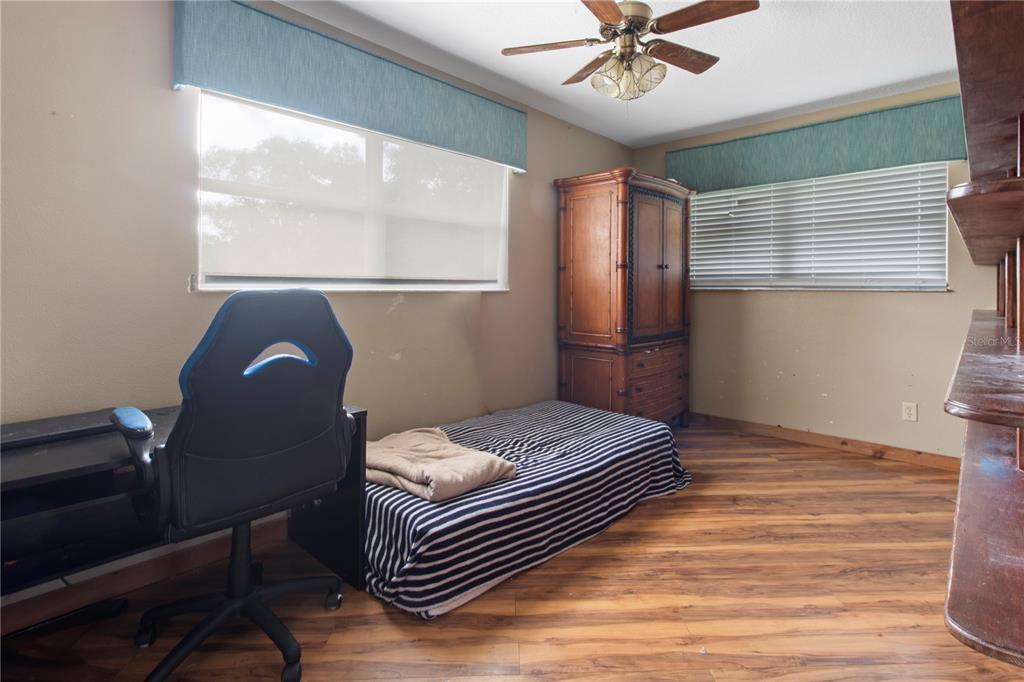 1143 Meyers Road Venice, FL 34292 - Photo 22 of 59 a bedroom with a bed and a window