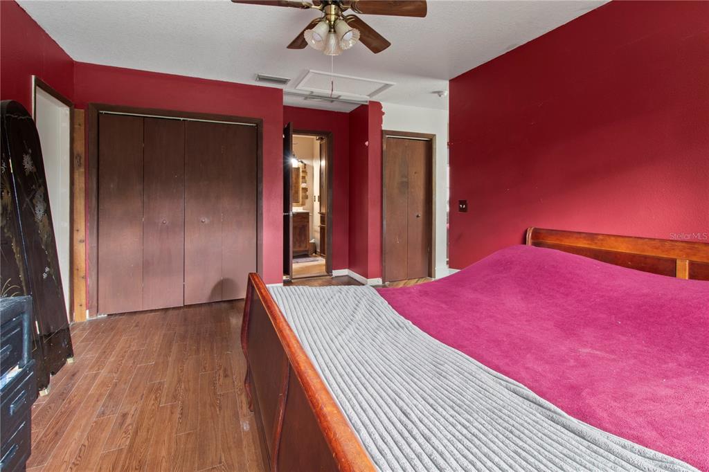 1143 Meyers Road Venice, FL 34292 - Photo 24 of 59 a bed room with a bed and a chandelier