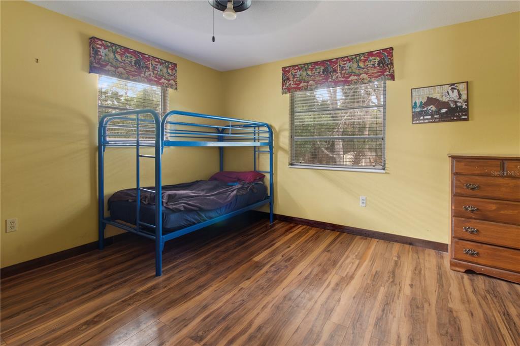 1143 Meyers Road Venice, FL 34292 - Photo 25 of 59 a bedroom with furniture and window