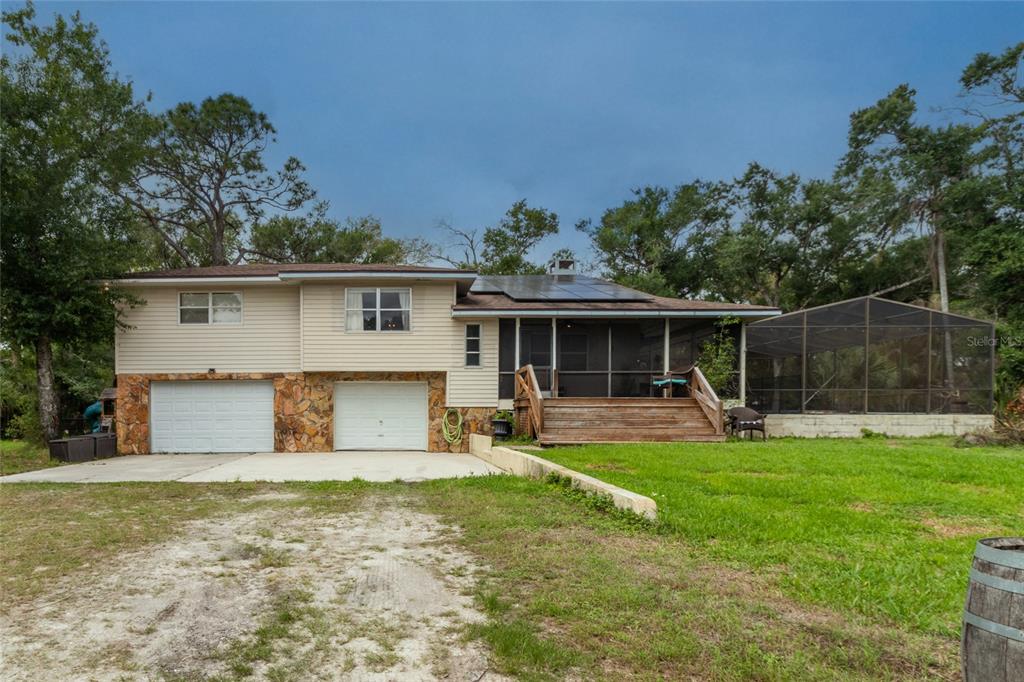 1143 Meyers Road Venice, FL 34292 - Photo 39 of 59 a house view with a sitting space garden in front of it