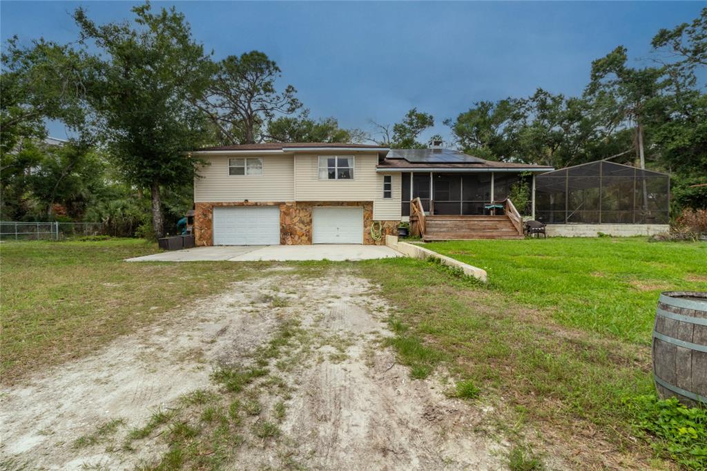 1143 Meyers Road Venice, FL 34292 - Photo 40 of 59 a house view with a sitting space and garden