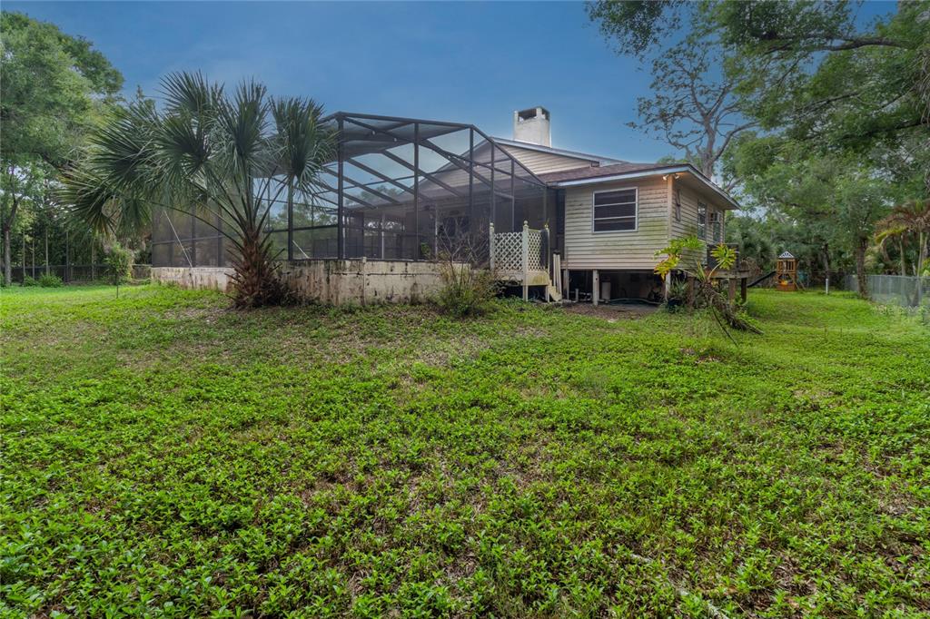 1143 Meyers Road Venice, FL 34292 - Photo 47 of 59 a view of a house with a backyard