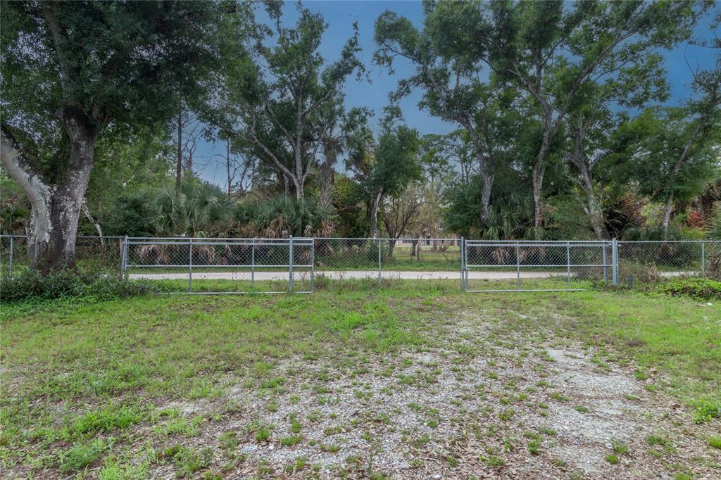 1143 Meyers Road Venice, FL 34292 - Photo 48 of 59 a view of a yard with a fence