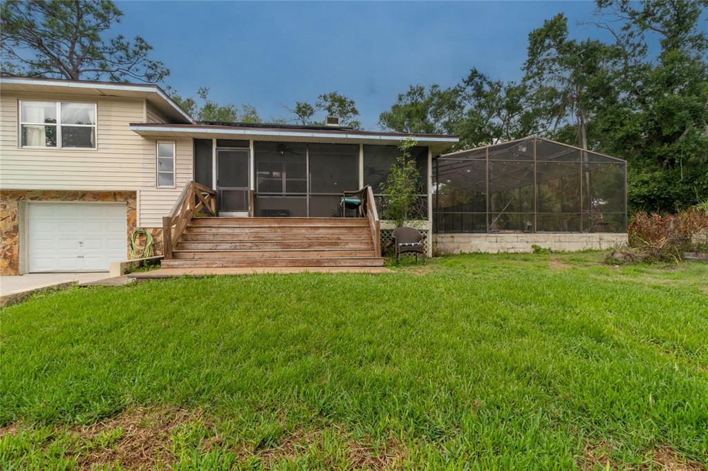 1143 Meyers Road Venice, FL 34292 - Photo 50 of 59 a view of a house with a yard and a garden