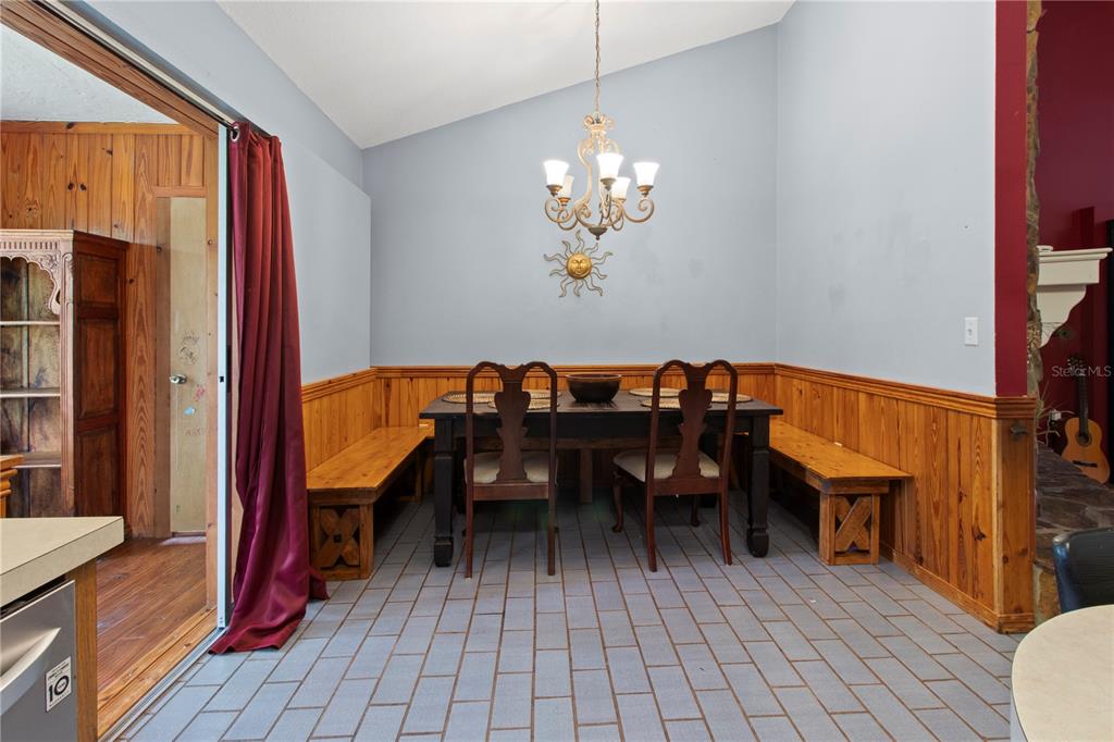 1143 Meyers Road Venice, FL 34292 - Photo 9 of 59 a view of a dining room with furniture and chandelier