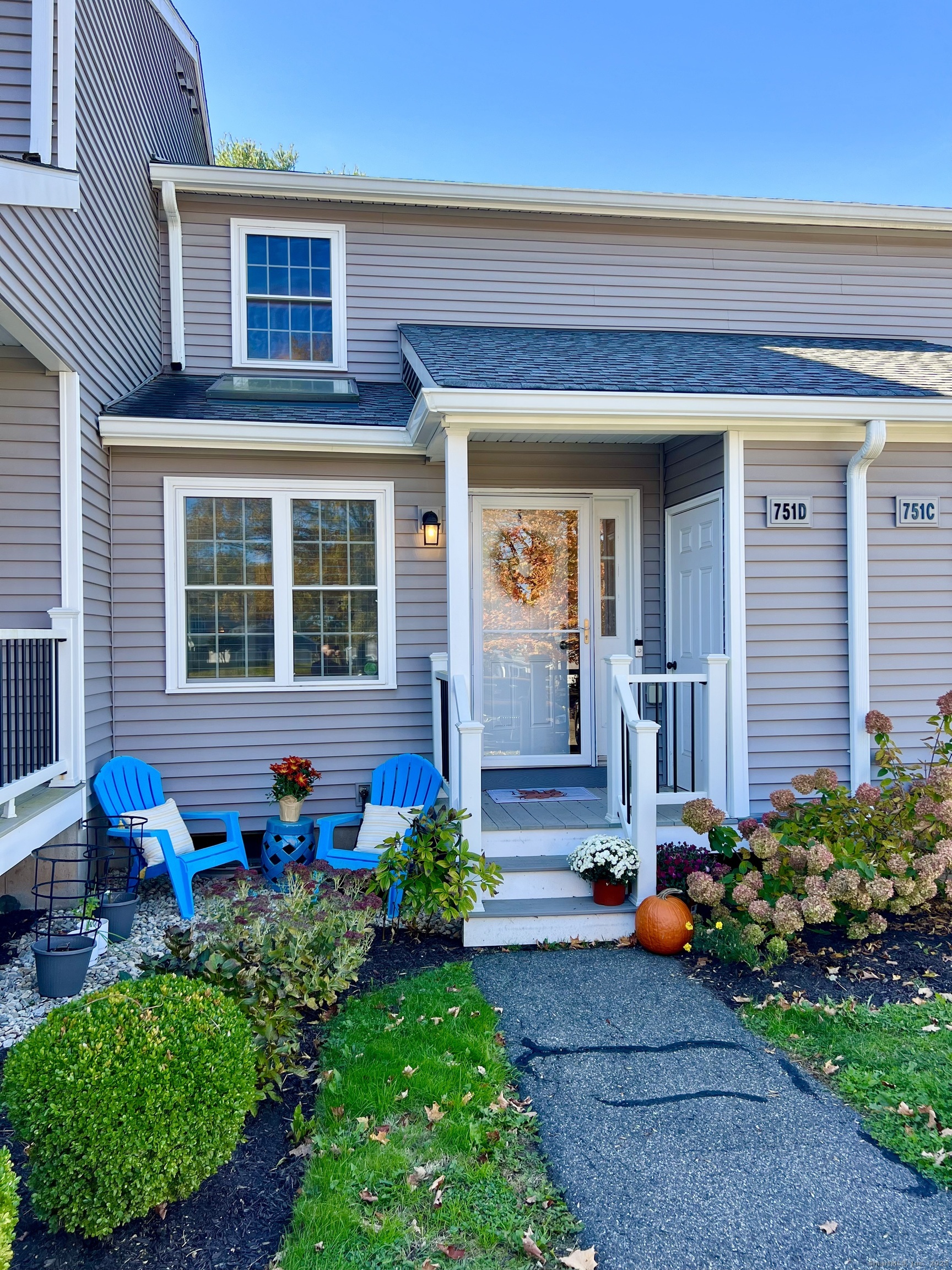 751 Long Hill Road, Unit D Middletown, CT 06457 - Photo 1 of 28 a front view of a house with garden