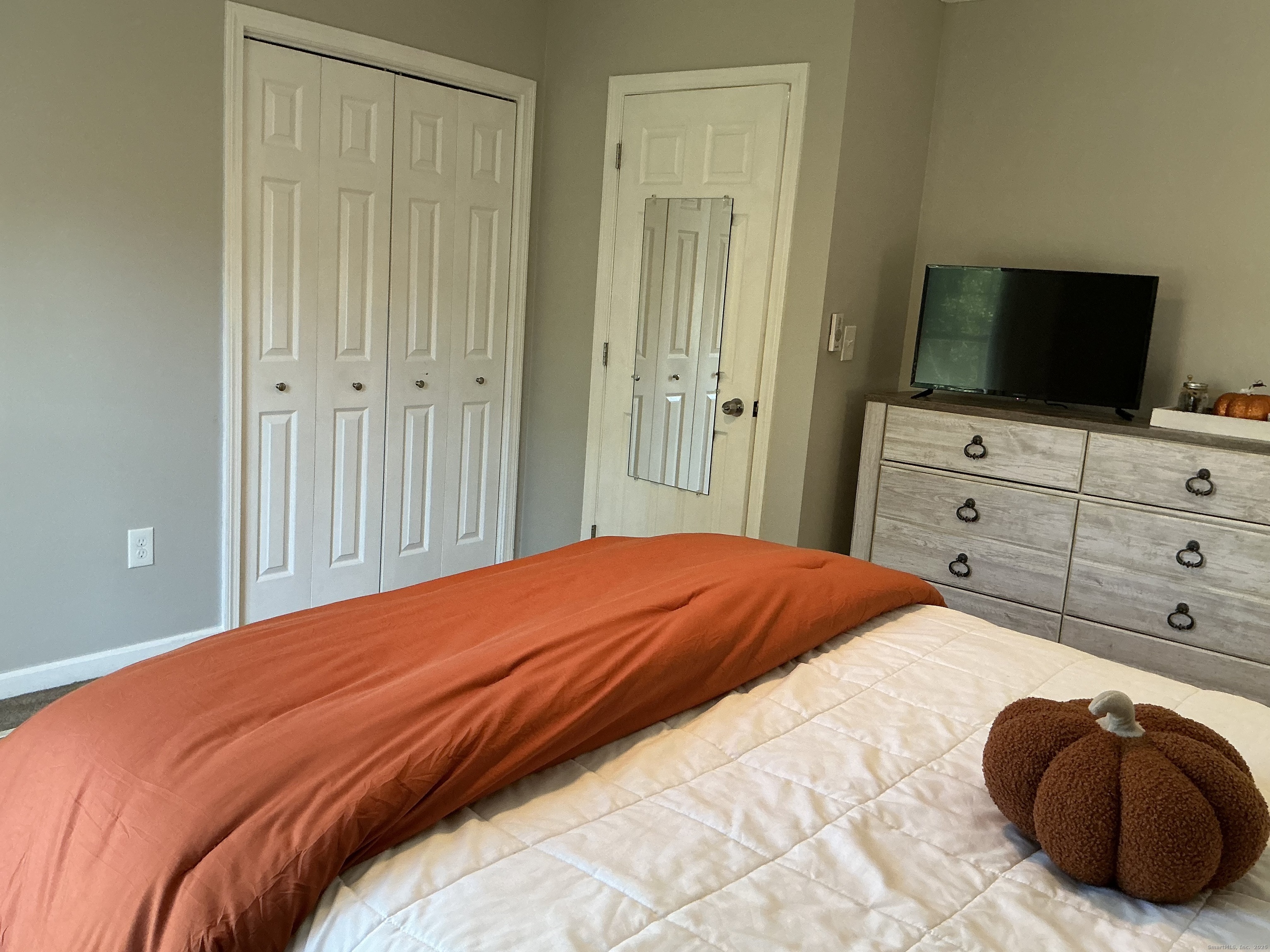 751 Long Hill Road, Unit D Middletown, CT 06457 - Photo 14 of 28 a bedroom with a bed and a television