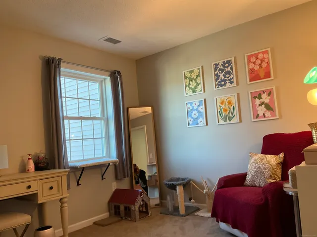 a livingroom with window and a couch