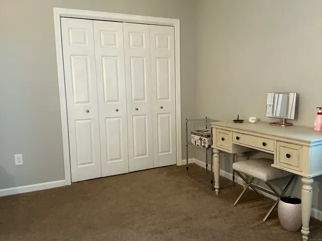 a view of a workspace with furniture