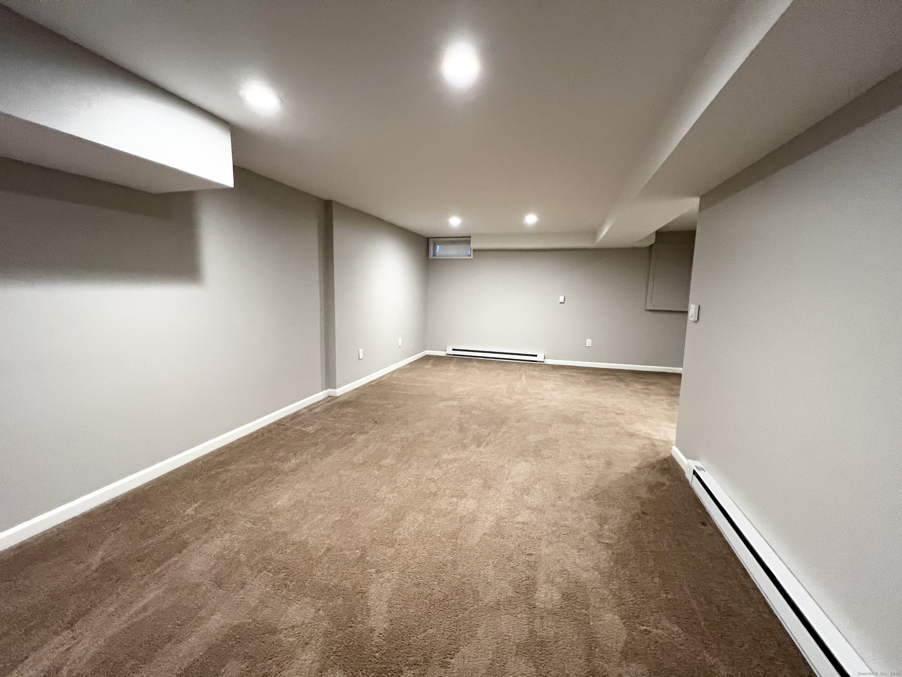 751 Long Hill Road, Unit D Middletown, CT 06457 - Photo 20 of 28 an empty room with a workbench